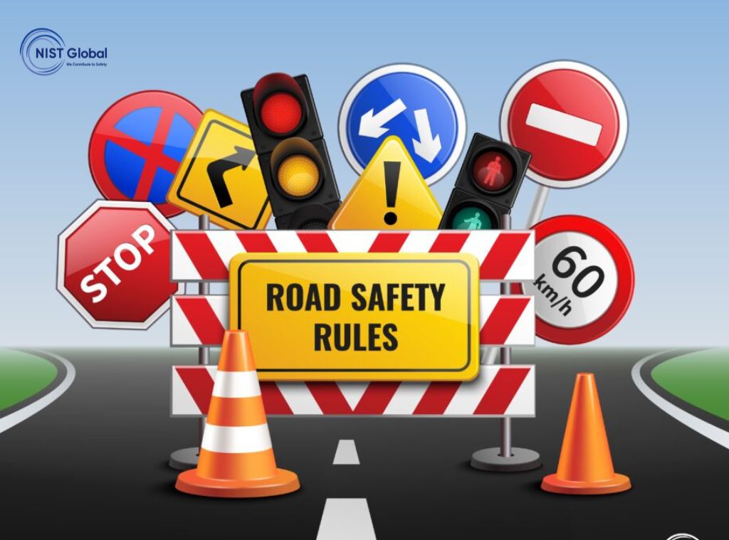 Illustration featuring multiple road safety signs including stop, speed limit, traffic lights, and direction indicators, with a central board reading "Road Safety Rules."