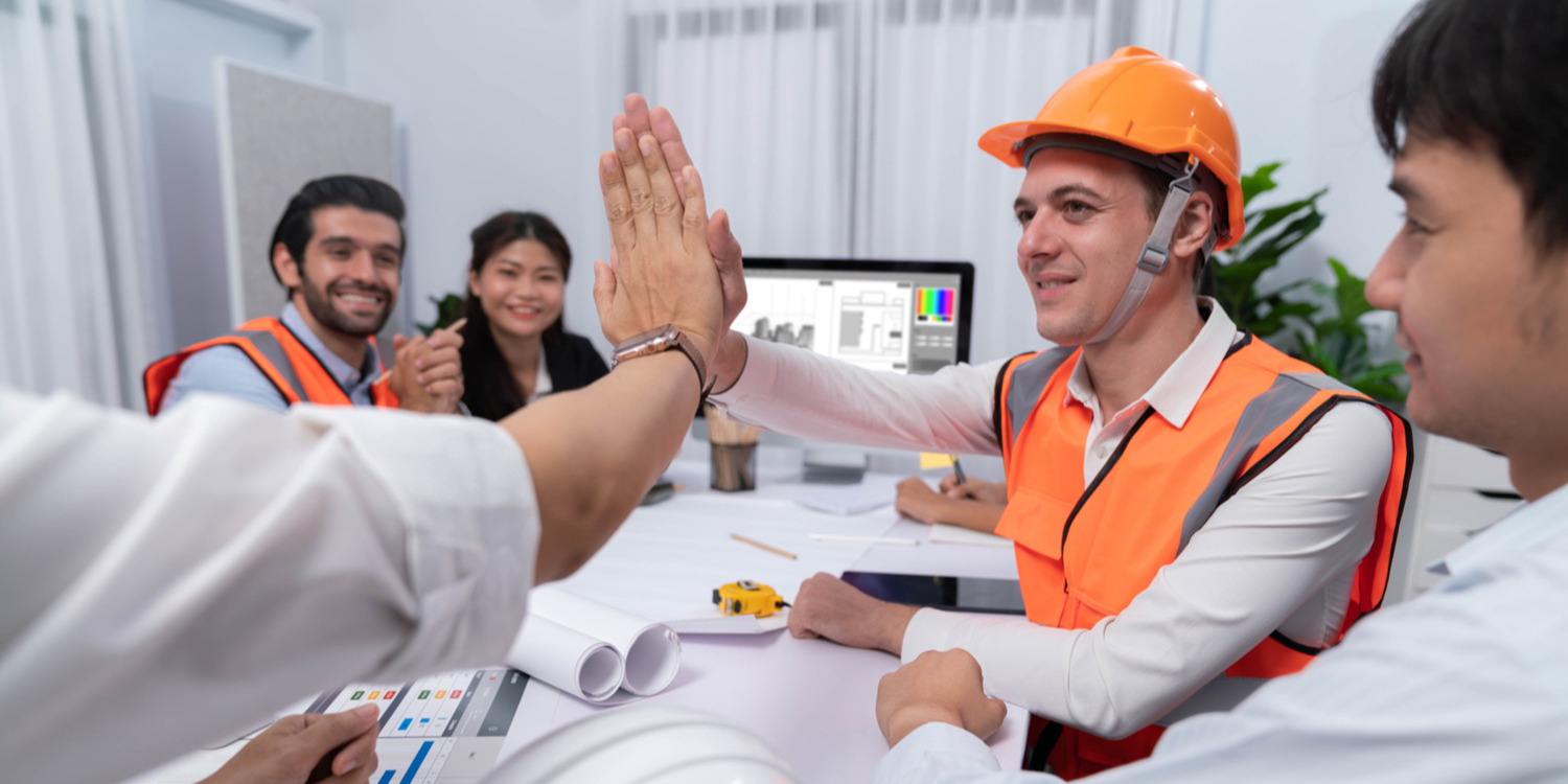 Team demonstrating a strong culture of safety in the workplace through collaboration and safe practices