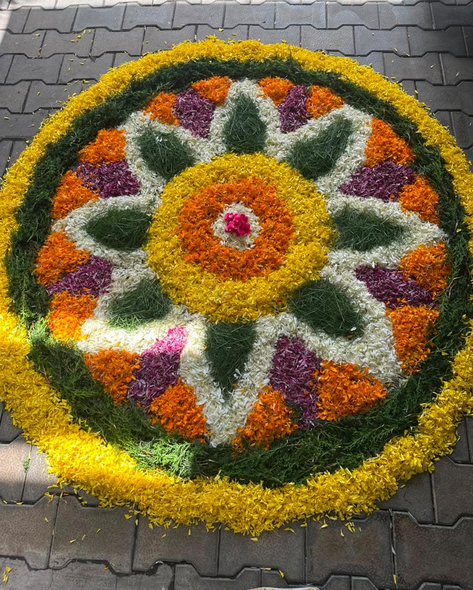 Team creating a Pookalam